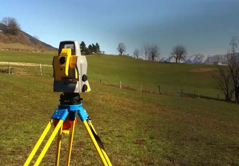 land surveying equipment out on field conducting a survey