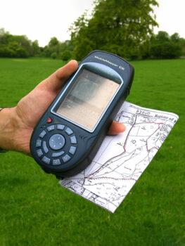 Man holding hand-held GPS for land surveying
