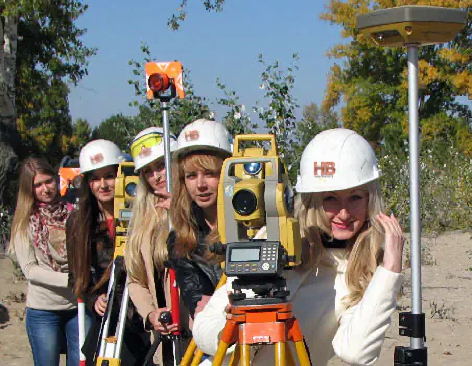 an image of 5 Women conducting a house location survey on a beautiful sunny spring day