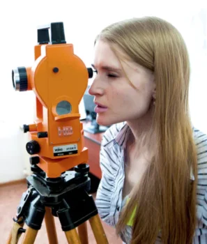 A woman conducting a House Location Survey in McHenry Maryland